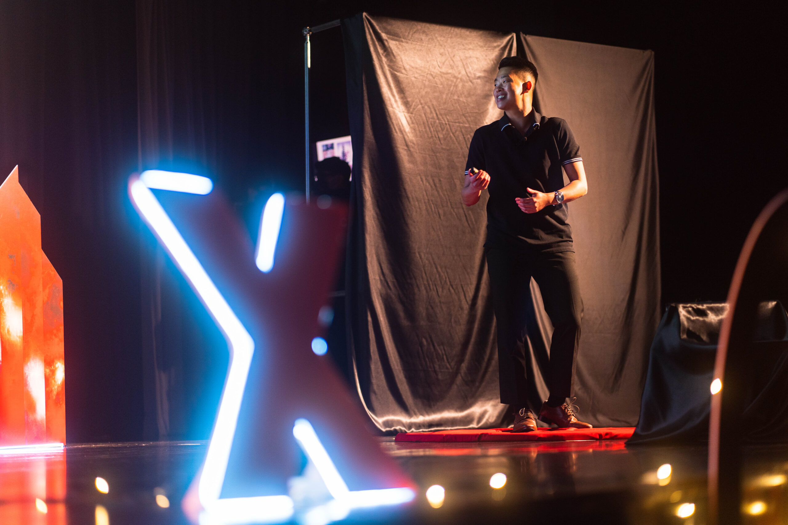 Emery on TEDx Stage